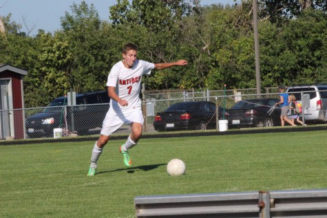 Lucas Semitka kicks the ball down the field.