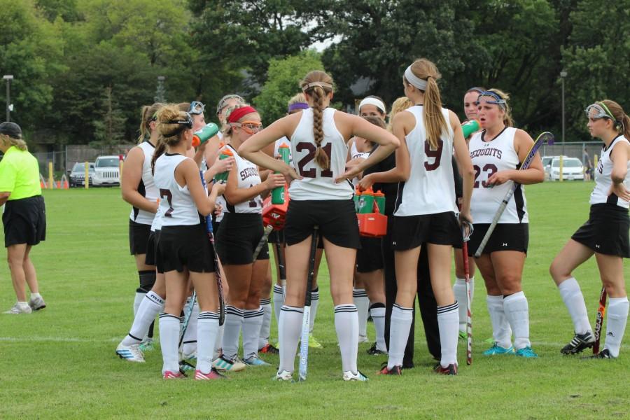 ACHS Varsity Field Hockey team huddles up during halftime in the ACHS vs. Deerfield game on Aug. 27.