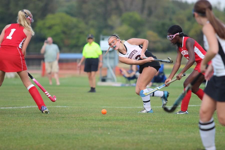 ACHS+Junior+Natalie+Nielsen+drives+the+ball+up+the+field.+