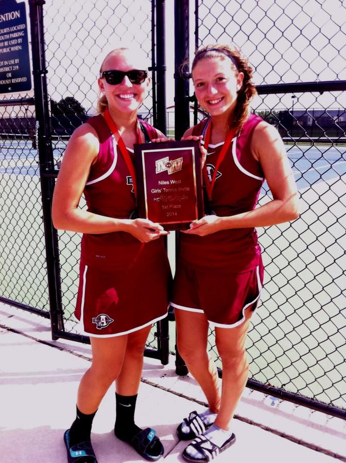 Juniors Annie Horner and Anna Arden hold up a first place plaque at the Niles West Invite. 