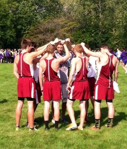 The Cross Country Team Huddles Together Before Their Meet