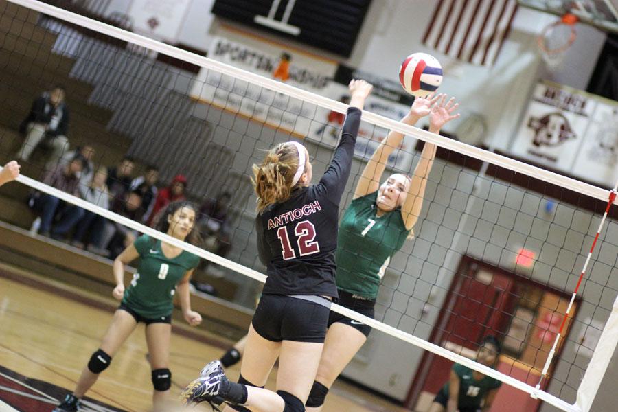 Senior Amanda Spera spikes the ball in the Regional Final against Wauconda. 