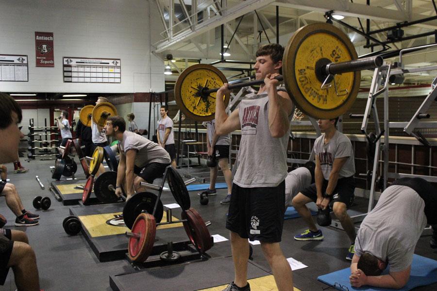 Junior Ryan Monaco lifting on the weight deck during crossfit.