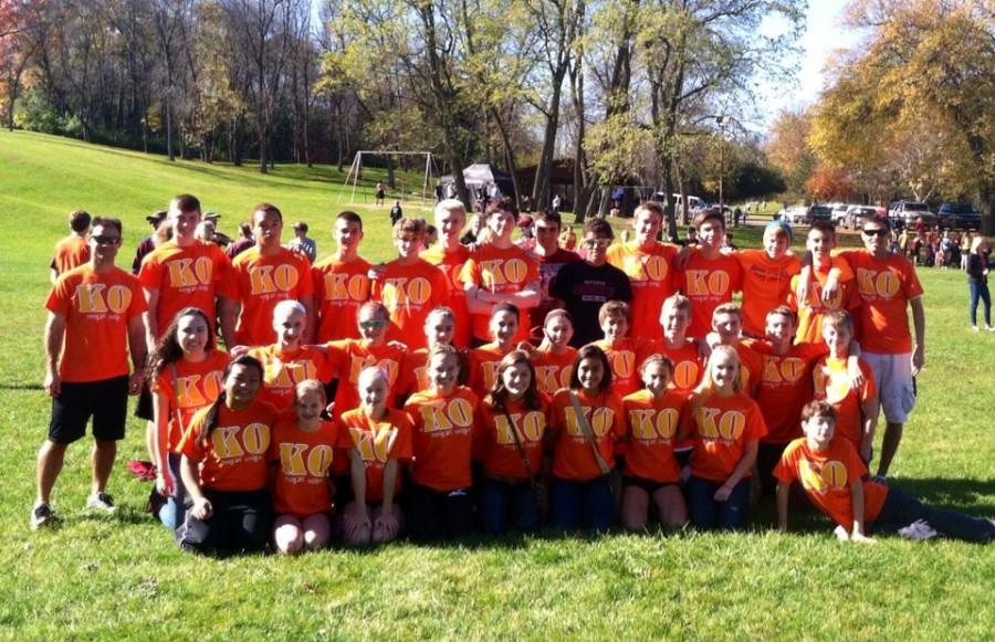 The Cross Country Team Supports Tyler Oslage by Wearing Orange Shirts at Regional Meet
