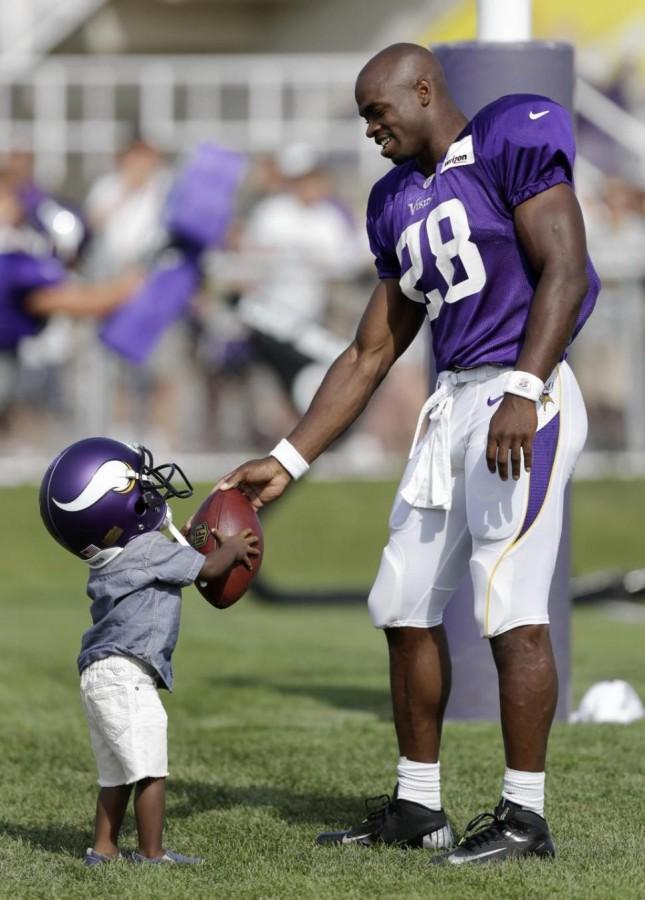Adrian Peterson Shares a Moment With His Son
