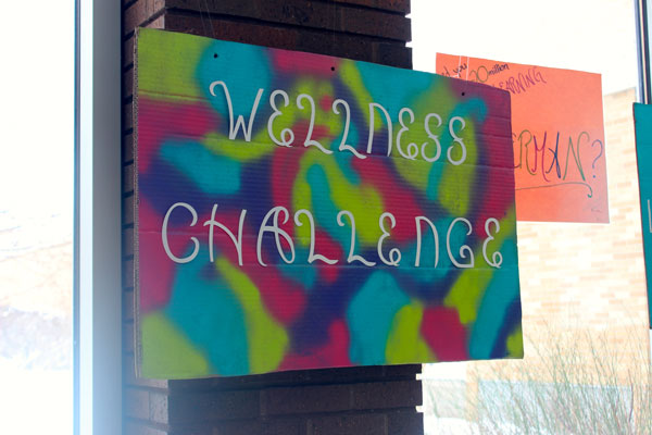 Students promote the Sequoit Wellness Challenge by hanging posters in the commons