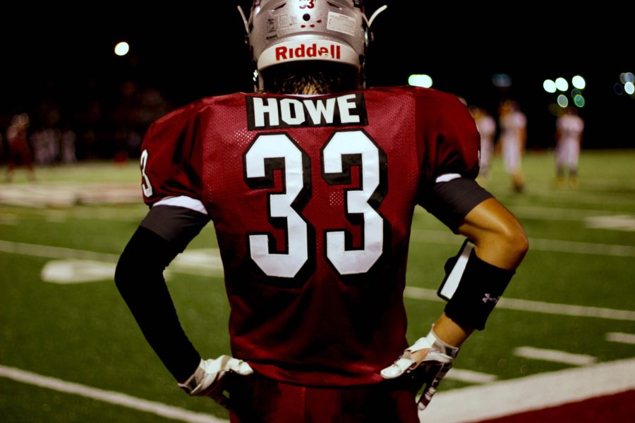 Watching his team fight against Wauconda, senior John Howe proudly cheers the Sequoits on from the sideline. It makes me feel proud to be a part of something special, said John. I love to watch some of my best friends doing what they love. The Sequoits defeated the Bulldogs on September 9, 33 to 29.  Caption by Tasha Reid