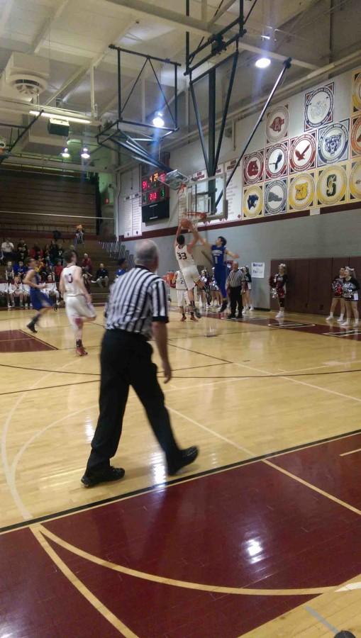 Weston Fox going up for a basket against the Vernon Hills Cougars