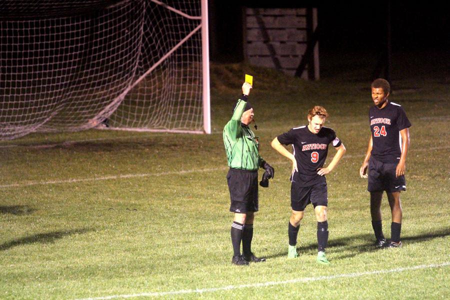 Senior Captain Danny Brito receives a yellow card in the first half of the boys sectional loss. 
