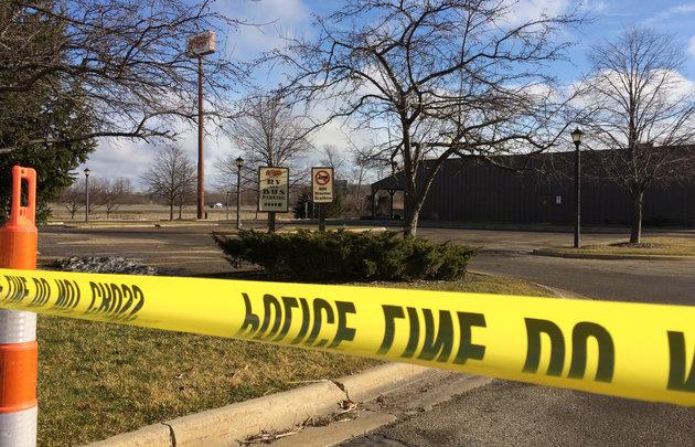 Police tape surrounds the area of a random shooting on Sunday, Feb. 21, 2016, in Kalamazoo, Mich.  Jason Dalton of Kalamazoo County was arrested early Sunday in downtown Kalamazoo following a massive manhunt after several victims were shot at random.  (AP Photo/Jeff Karoub)