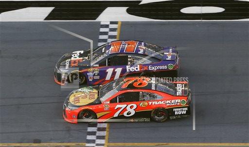 Denny Hamlin  beats out Martin Truex Jr. at the finish line.
(Associated Press).