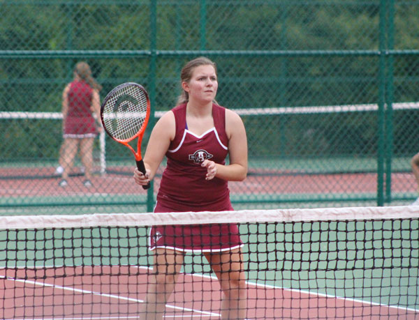 Taylor Horner prepares to hit a tennis ball.