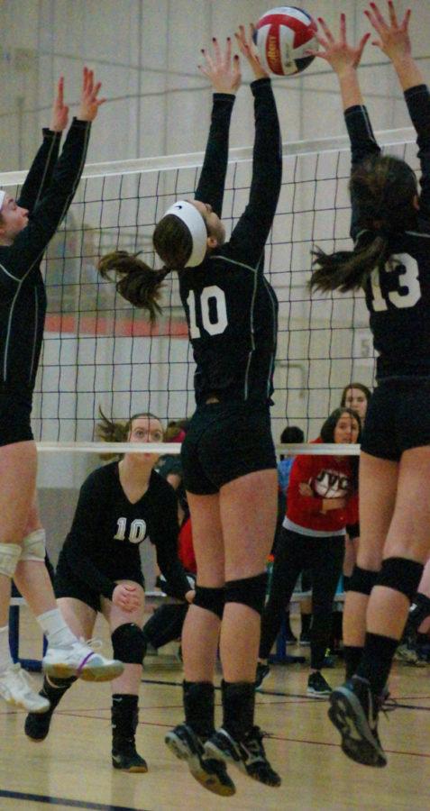 Senior Alexa Spokas blocks a spike for the Sequoits.