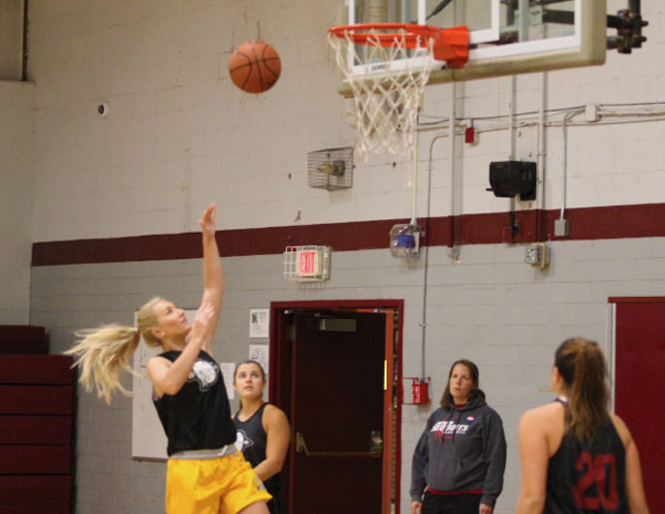 Erika Gallimore goes up for a lay up while running a play during the first week of girls basketball practice.
