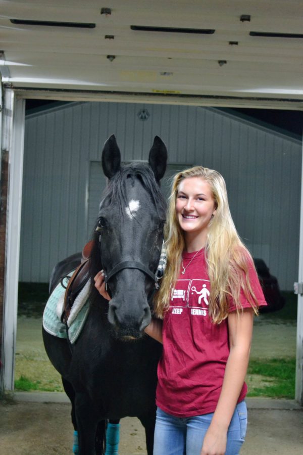 When she has down time from tennis, Kelsey Neville participates in weekly horseback riding lessons along with summer competitions.