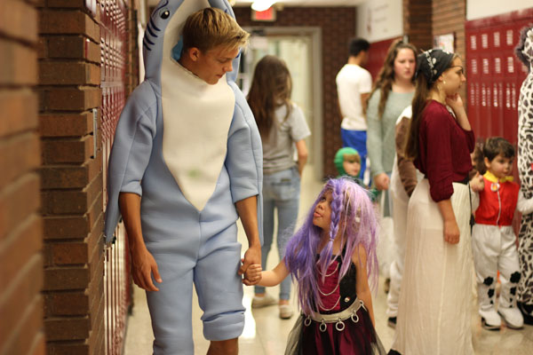 On Thursday October 27th, the Little Sequoits Preschool kicked off Halloween festivities by Trick-or-Treating through the halls. Senior Cody Matonik guided preschooler Mykah through the halls. Mykah was dressed as Mal from Descendants and Cody was dressed as a shark. The two made a fin-tastic pair! Caption by RaeAnn Leist