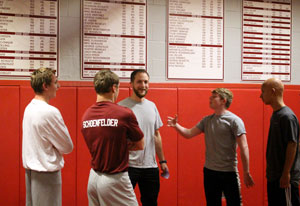 Coach talking with his players.
