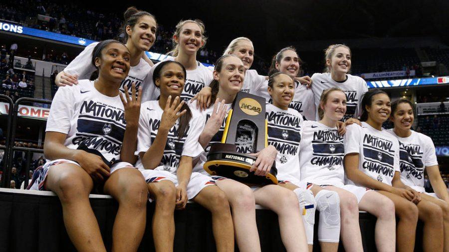 The+Connecticut+University+girls+basketball+team+after+winning+the+championship+last+year.+