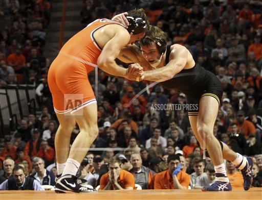 Oklahoma State wrestler Anthony Collica, left, and Iowa wrestler Brandon Sorensen wrestle during their dual in Oklahoma on Sunday, January 15.