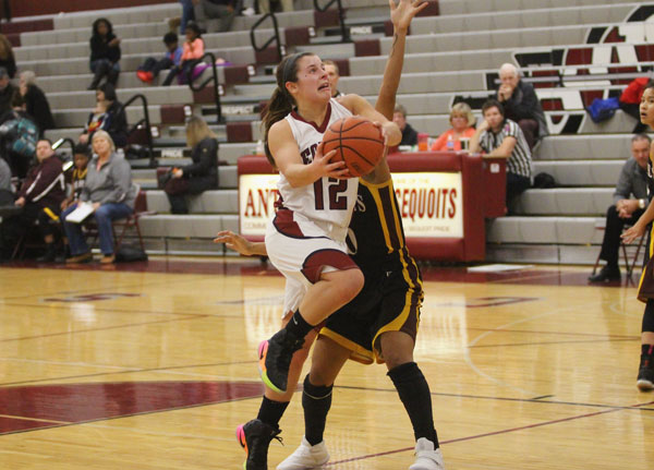 Ashley Reiser drives to the basket before scoring on a layup in a game against Zion-Benton last Wednesday.