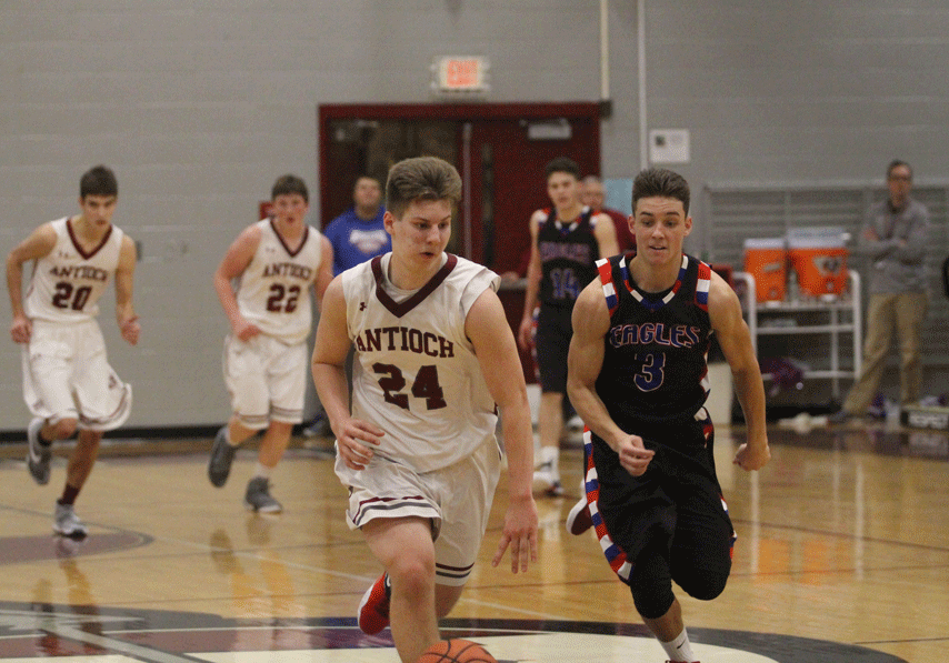During the game against Lakes sophomore Daniel Fillipone dribbles to the other side of the court to try and get another point for the Sequoits. 