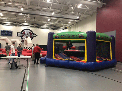 On Tuesday, Feb. 14, ACHS Summer in Winter activity allowed students to take part in cart racing and bouncy house boxing.