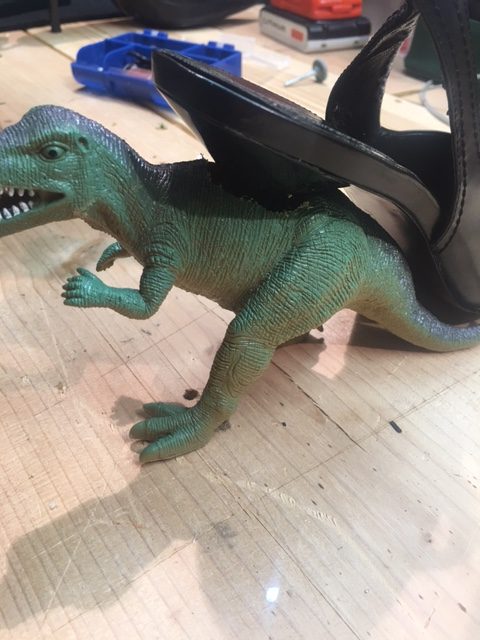 Place heel into the large hole created in the back of the dinosaur, widen if necessary.