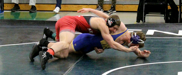 Patrick Schoenfelder wrestling against, his opponent ,Wauconda.