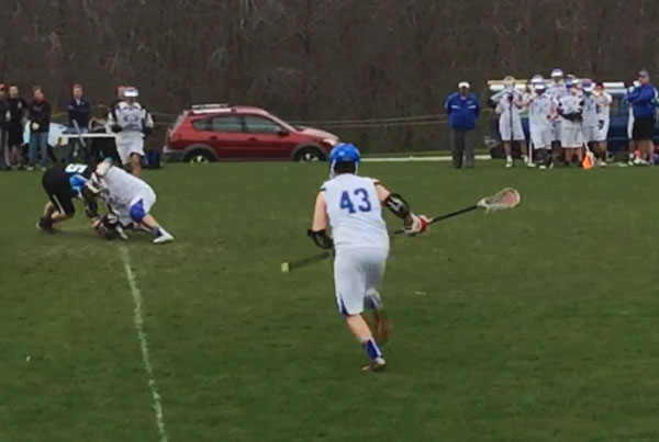 Patrick Beake runs toward a scrum during a game last year.