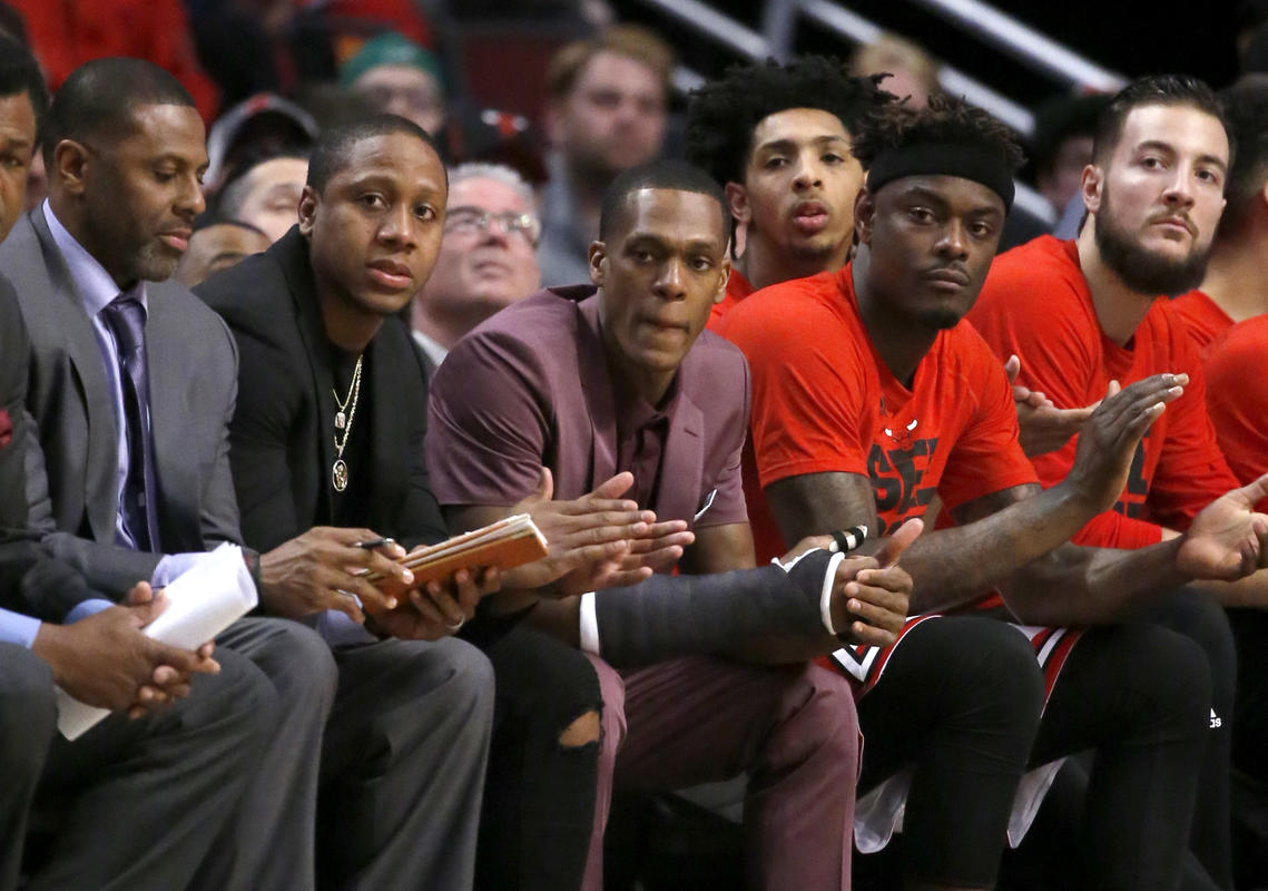 With a cast on his right thumb, Chicago Bulls Rajon Rondo, center sits on the bench during the first quarter in Game 3 of the teams NBA basketball first-round playoff series against the Boston Celtics in Chicago, Friday, April 21, 2017. (AP Photo/Charles Rex Arbogast)