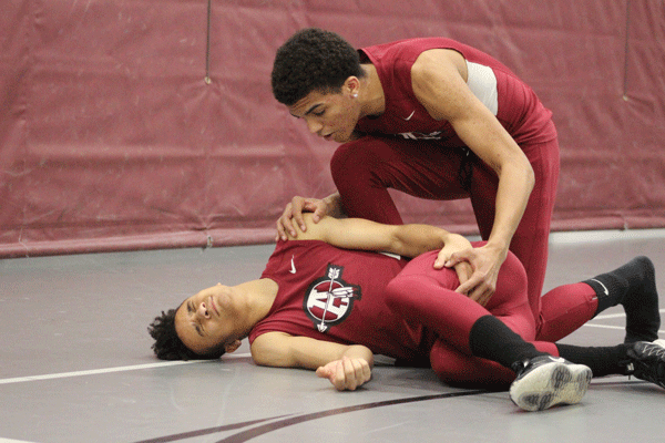 Junior Javen London and freshman TreShawn Watson act out a scenario as if  Watson’s track and field teammate had been injured. “If one of my teammates was hurt, I’d go up to them and tell them everything is going to be fine,” Watson said. “When you’re all wound up and hurt it makes the situation ten times worse. I’ll do my best to make them calm and go get the trainer for help.”