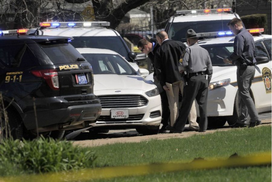 Police gather around the vehicle of the Facebook Killer, Steve Stephens. After posting a video of himself killing a man in Cleveland, Ohio, Stevens ran from police and eventually took his own life in Erie, Pennsylvania.