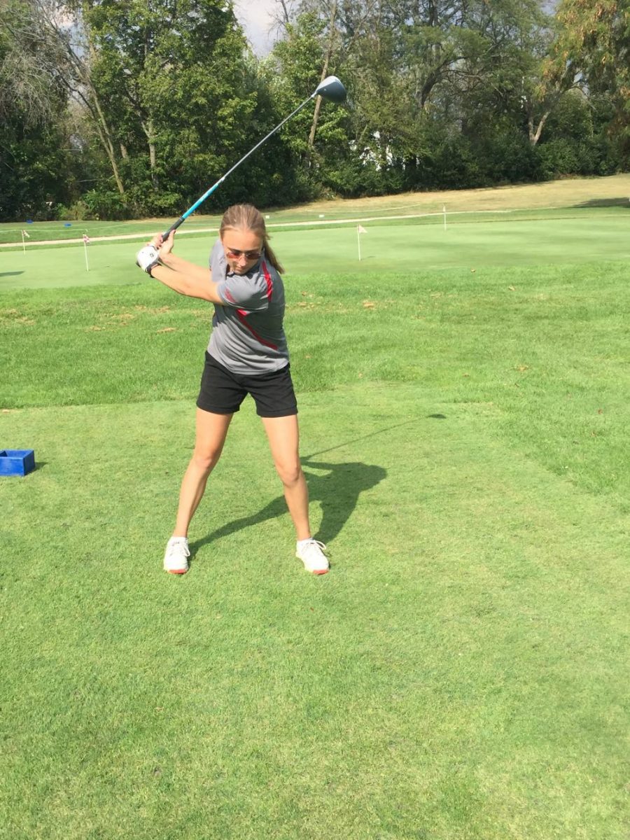 Samantha+Brown+warms+up+her+swing+before+beginning+the+18+holes.