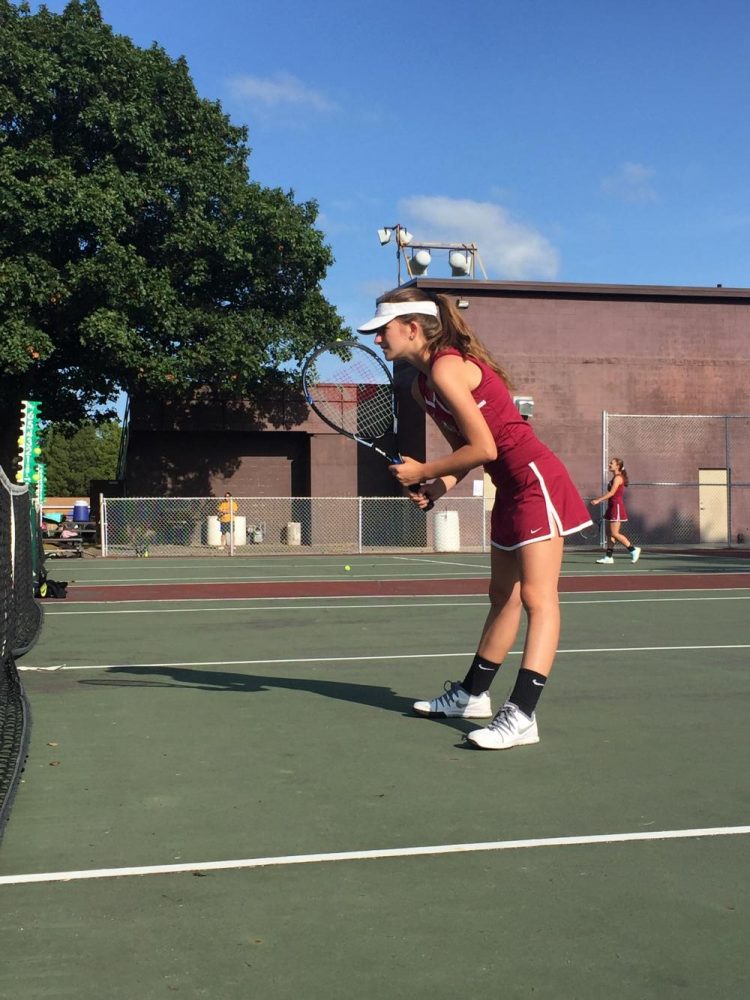 Sophomore Jenny Horner prepares to volley a hit from from the Waukegan Bulldogs.