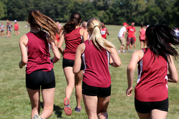 Girls Cross Country team warming up before their meet.