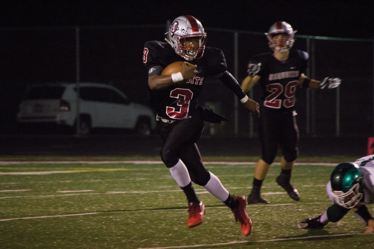 Senior Drew Porter catches and runs the ball during the second half of Friday nights game.