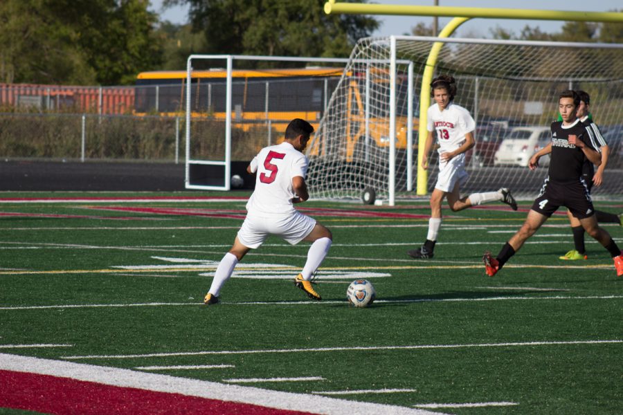 Micheal Espitia looking to cross the ball to Krystian Nikilov  