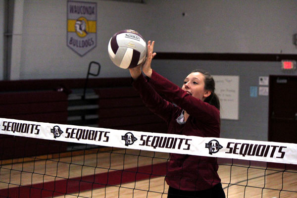 Senior Sally Bessette blocks a hit.