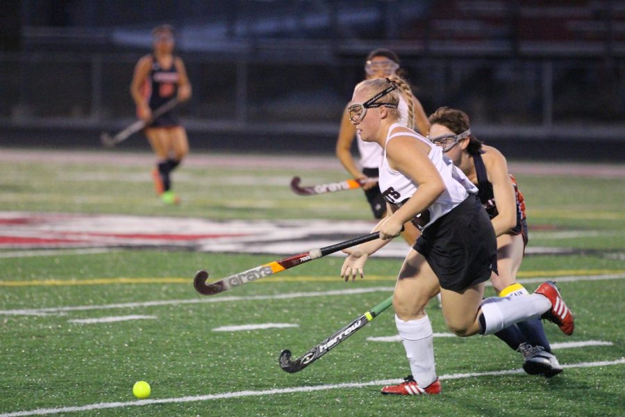Junior Karina Steitz fights to move the ball down the field to help her team score.