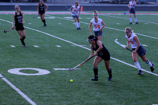 Sarah Smith moving the ball up the field.