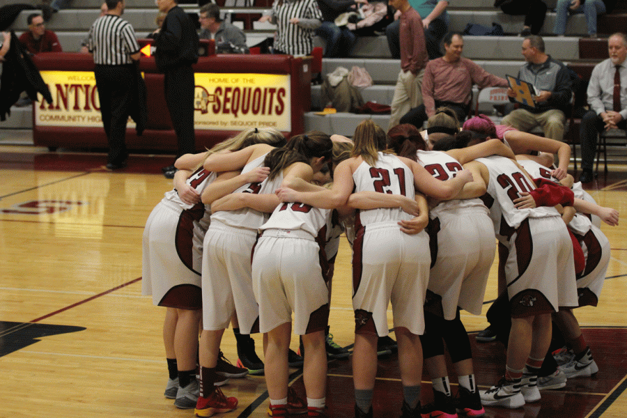 Girls huddle up before the game.