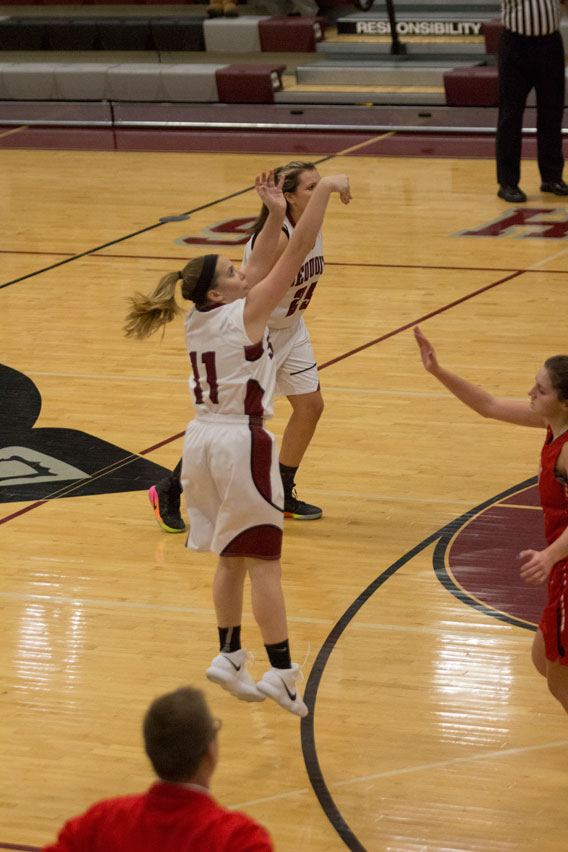 Senior Olivia Ori finishes her shot near the end of first half against the Grant Bulldogs.