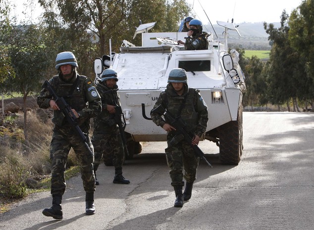 FILE - In this Jan. 14, 2009 file photo, Spanish U.N peacekeepers patrol the area where a rocket fell short in Lebanon several kilometers north of the Israeli border, near the village of el-Meri, southern Lebanon.  Russias aggressiveness in the east. The Islamic State groups sudden rise in the south. As Europes militaries register new threats close to home, theyre now being asked by the United States to make a strong return to peacekeeping around the world as well. (AP Photo/Hussein Malla)