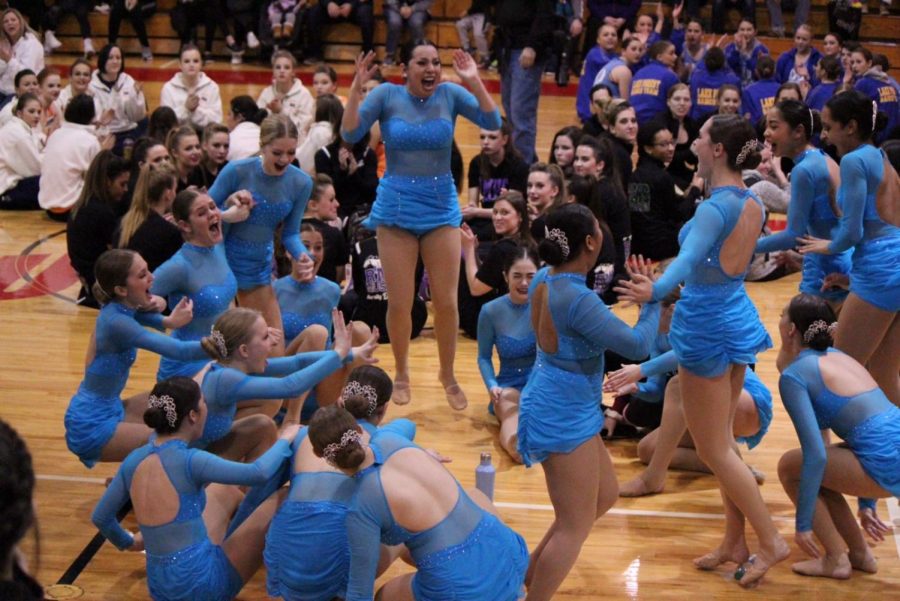 The dance team cheers with joy as they were named sectional champions