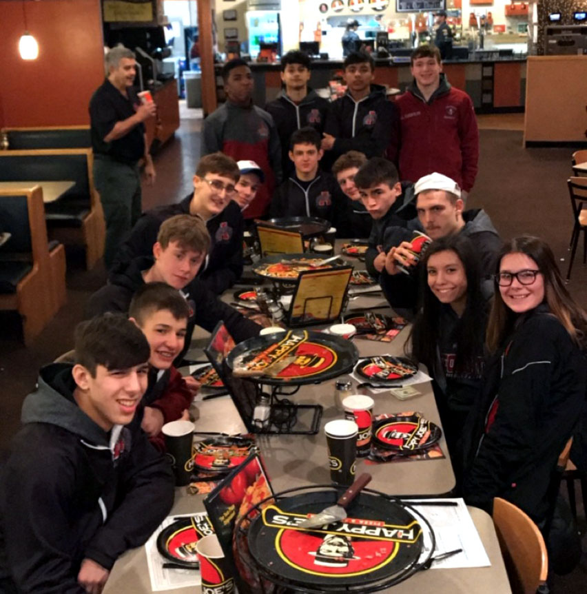 Sequoit wrestlers enjoy Happy Joes Pizza after a great tournament in Bettendorf, Iowa.