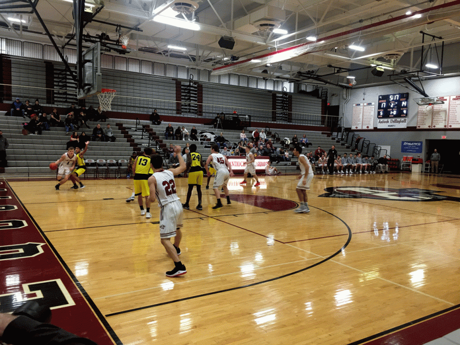 the boys varsity basketball team competes against Round Lake HIgh School