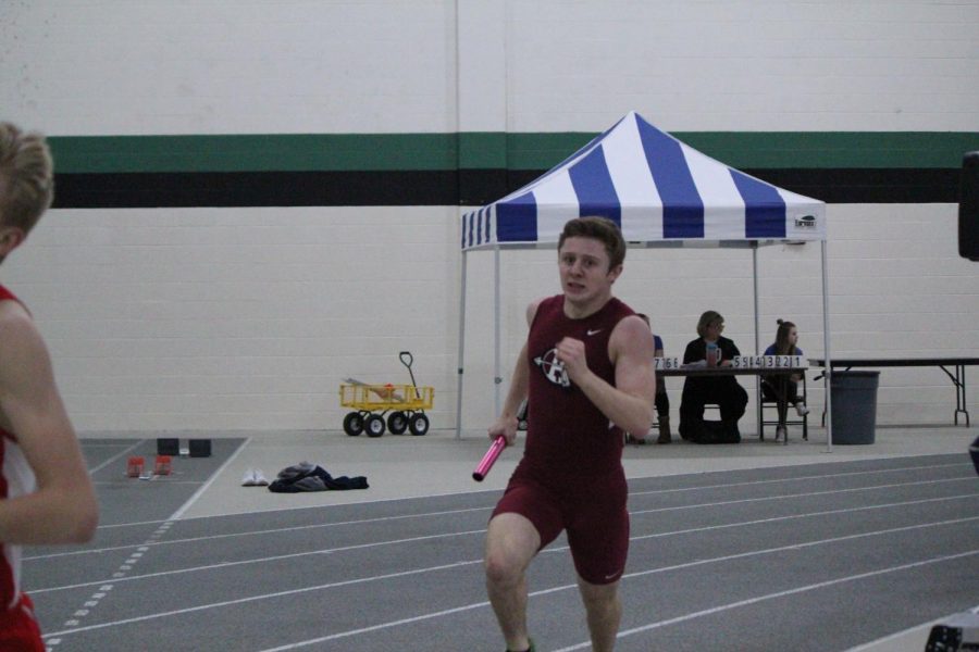 Junior Mikey Volkmar runs in the conference meet. 