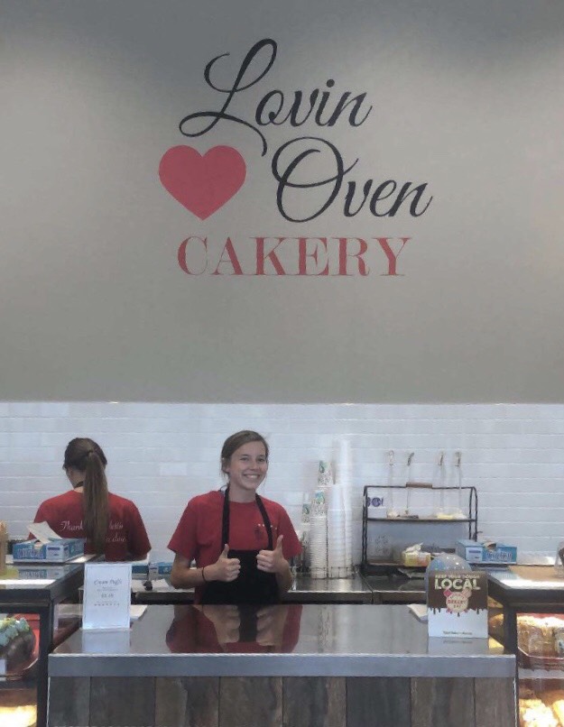 Lily Highley smiles behind the front counter at Lovin Oven Bakery.