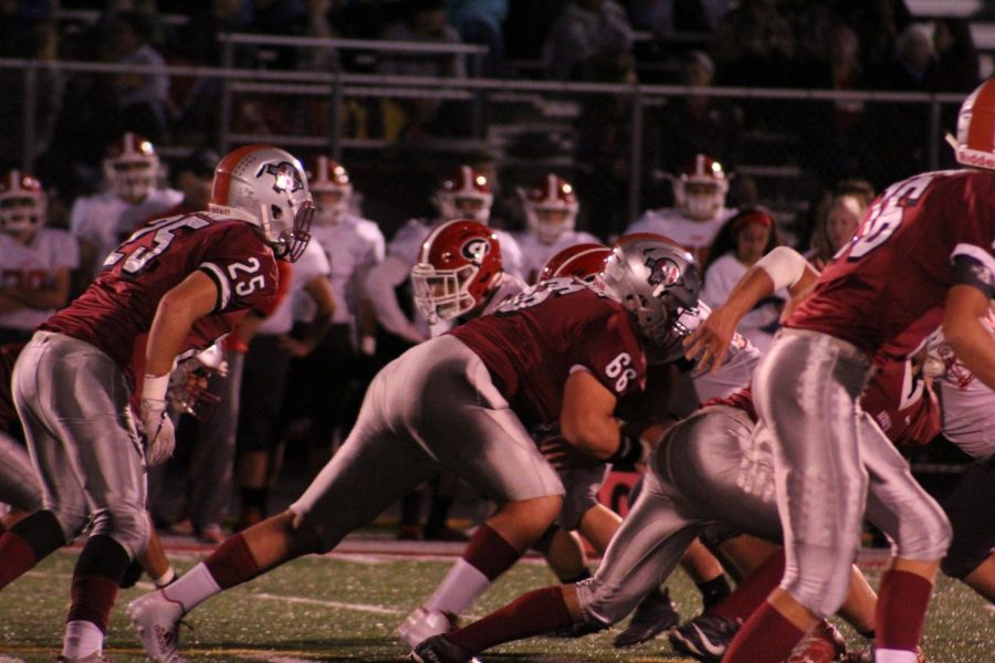 The Sequoit football team is ready to play as the ball is snapped.