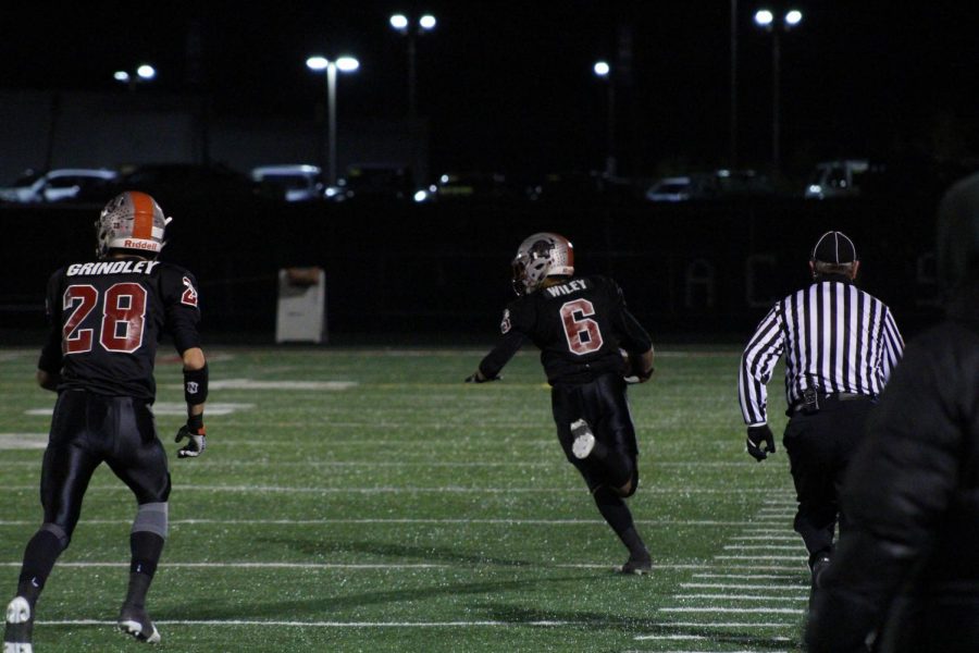 Senior running back Nick Wiley runs the ball back from a kick return to score a Sequoit touchdown. 